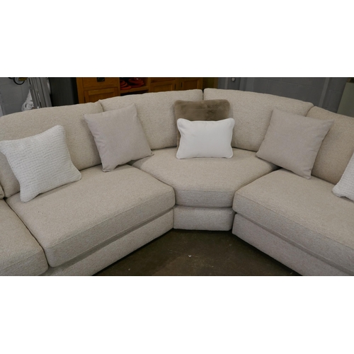 1409 - A large beige corner sofa on semi exposed frame - one odd cushion