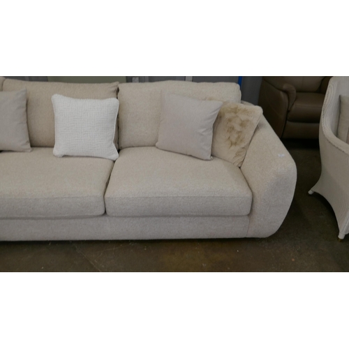 1409 - A large beige corner sofa on semi exposed frame - one odd cushion