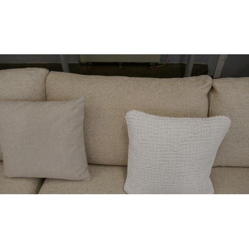 1409 - A large beige corner sofa on semi exposed frame - one odd cushion