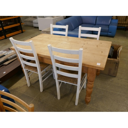 1446 - A pine dining table and four white chairs