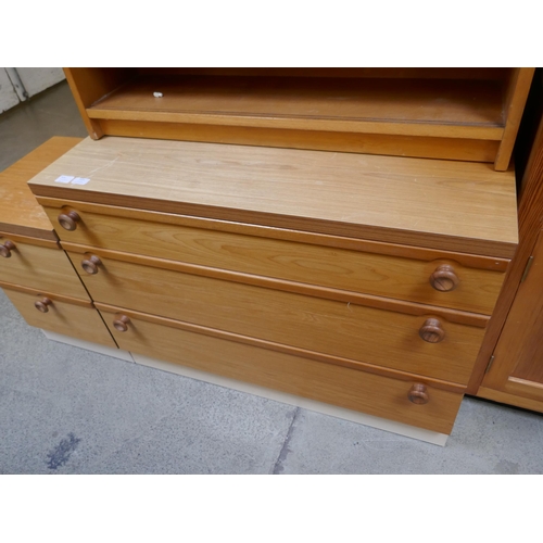 1455 - A bookcase, chest of drawers and bedside chest