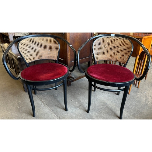 196 - A pair of ebonised bentwood elbow chairs