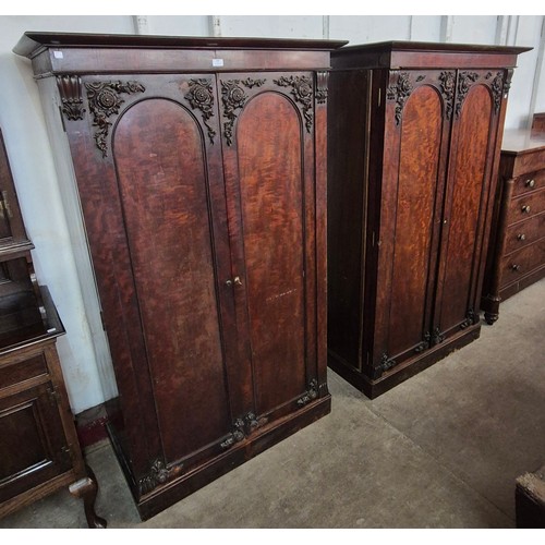 164 - A pair of Victorian carved mahogany linen press and wardrobe