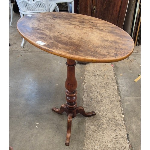 165 - A Victorian oval topped tripod wine table