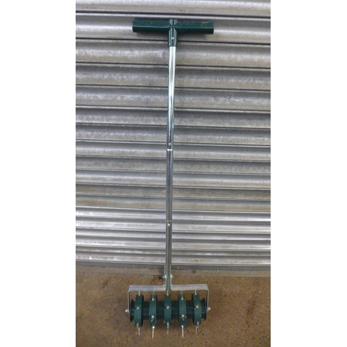 2341 - 4 lawn tools - 2 edgers, a lawn aerator and a rake