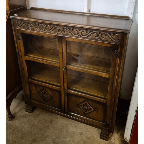 168A - A carved oak two door bookcase