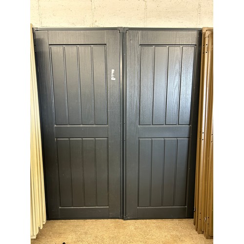 2357 - A pair of grey plastic shed doors