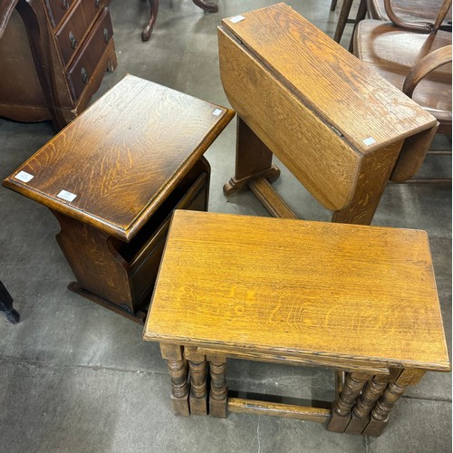 239 - An oak nest of tables, a small drop-leaf table and another table