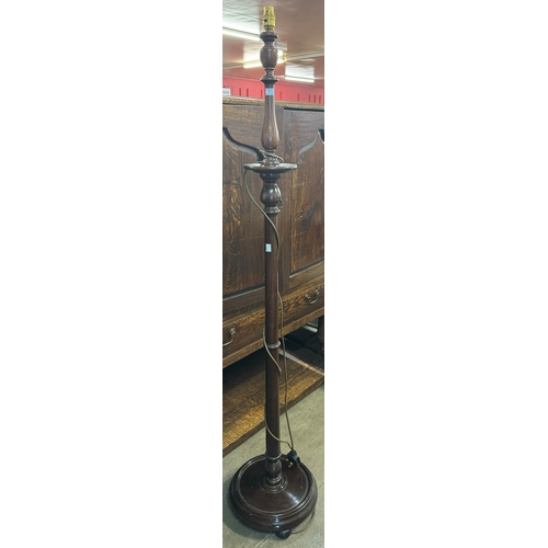 213 - An early 20th Century mahogany standing lamp