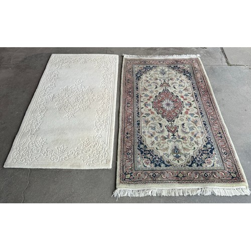 214 - A small beige ground rug and one other
Beige rug measurements:Length-149cm, Width-83cm
Other:Length-... 