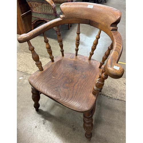 262 - A Victorian elm smokers bow chair