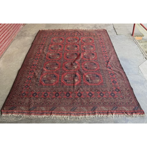 215 - An Eastern terracotta ground rug
Measurements: Length-299cm, Width-205cm