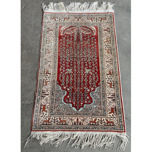 217A - An Eastern terracotta ground prayer rug
Measurements:Length-130cm, Width-67cm