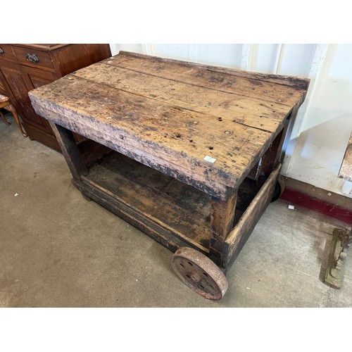 279 - An early 20th Century pine workbench on casters