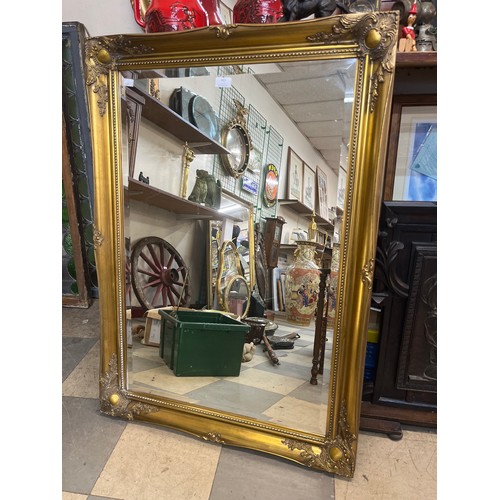 393 - A Victorian style gilt framed mirror