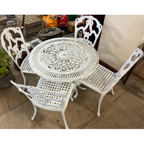 280 - A white painted cast alloy garden table and four chairs