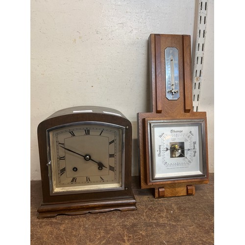 400 - A walnut mantel clock and an oak aneroid barometer