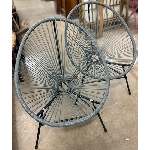 283 - A pair of black metal and vinyl garden chairs