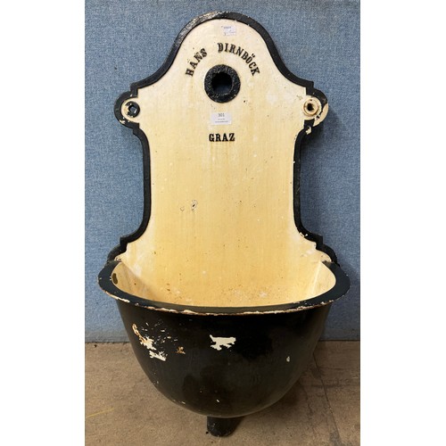 301 - An Austrian Hans Dirnböck cast iron wall mounted water font