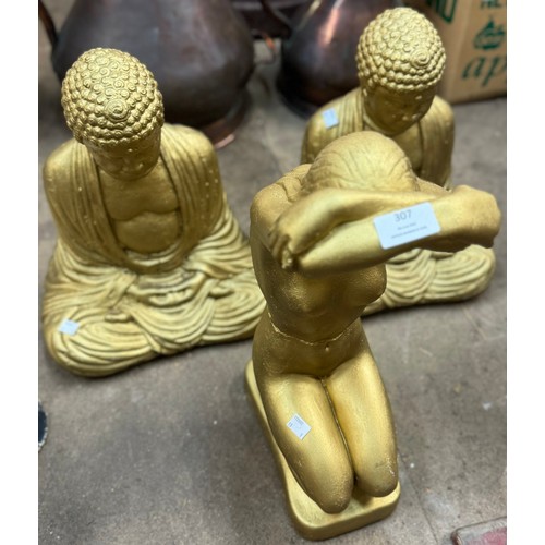 307 - A pair of gold coloured concrete garden Buddha's and a figure of a lady