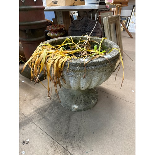 317 - A large concrete garden urn on stand