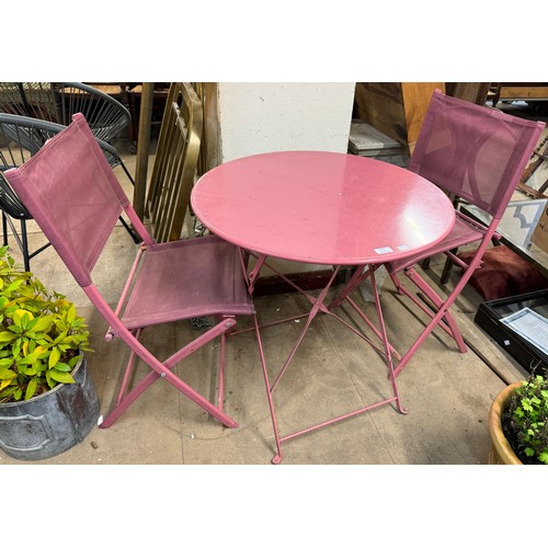 308 - A painted metal garden table and chairs