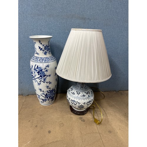 318 - A blue and white porcelain vase and a table lamp