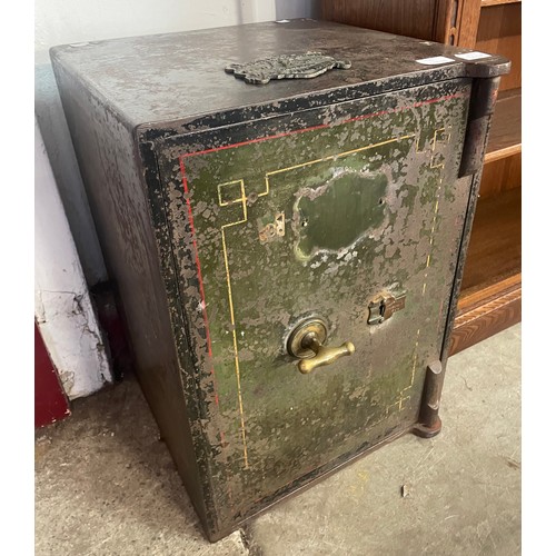 284A - A J. Cartwright & Sons, West Bromwich cast iron safe, with keys