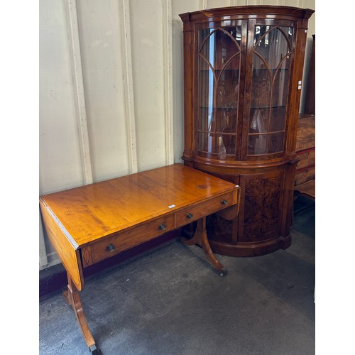 247 - A Regency style yew wood sofa table and a burr walnut corner display cabinet