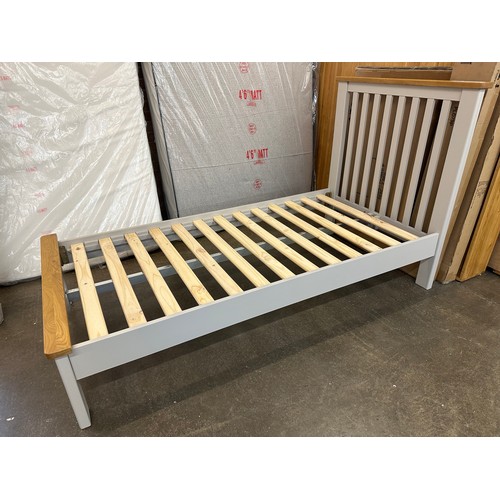 1426 - A grey painted and oak single bedframe