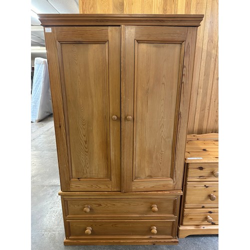 1498 - A two door pine wardrobe and dressing table