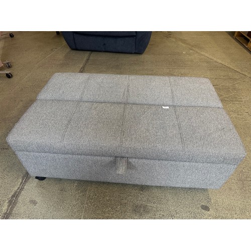 1429 - A Fabric sleeper ottoman Synergy Duluth