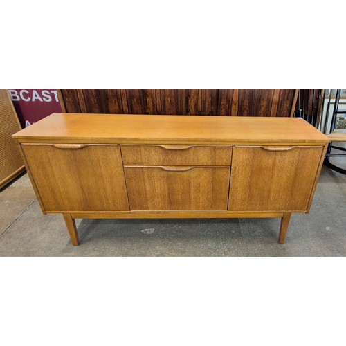 25 - A teak sideboard