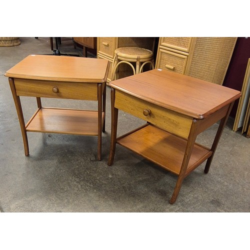 81 - A pair of teak single drawer lamp tables
