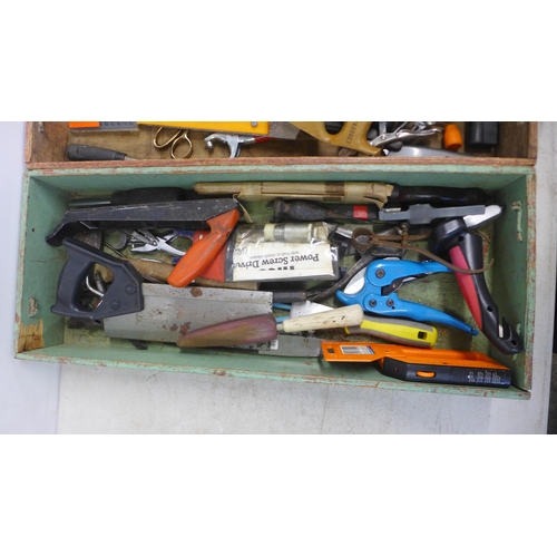 2028 - Four wooden trays containing a large quantity of assorted hand tools including saws, spanners, grips... 