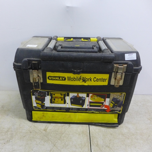2037 - Stanley mobile work center toolbox, a reel of electrical cable, a hydraulic trolley jack and a quant... 