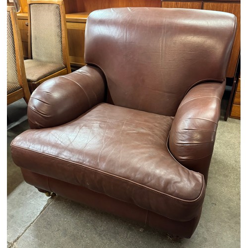 93 - A brown leather armchair