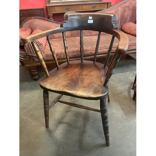 102 - A Victorian elm and beech smokers bow chair