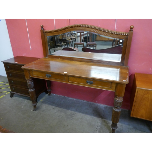 108 - A Victorian oak two drawer mirrorback serving table