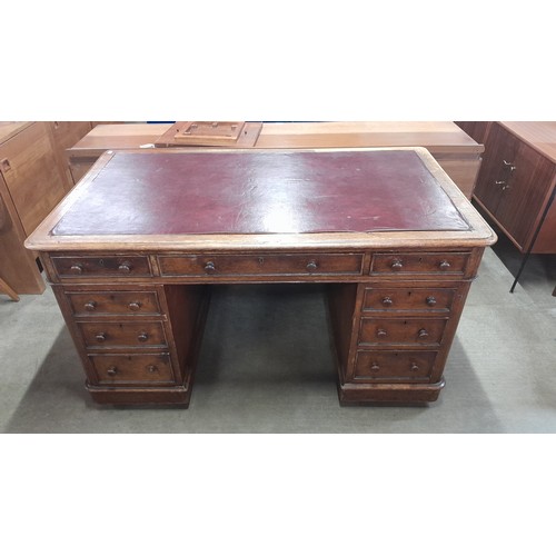 126 - A Victorian oak pedestal library desk