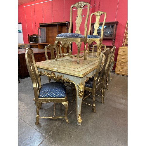 101 - An Italian Rococo style cream and parcel gilt dining table and eight chairs