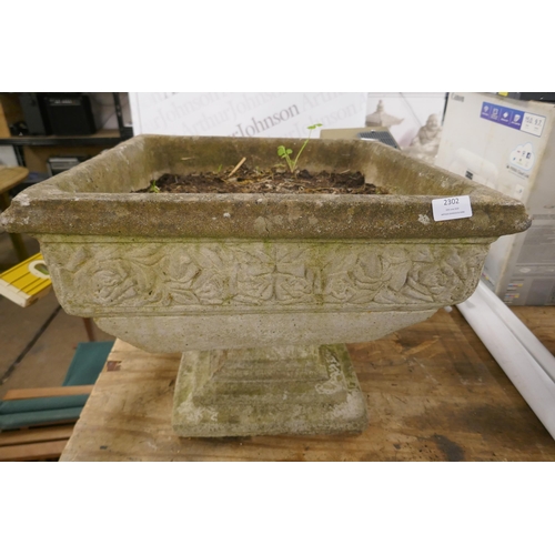 2302 - A large square stone effect concrete planter with pedestal base