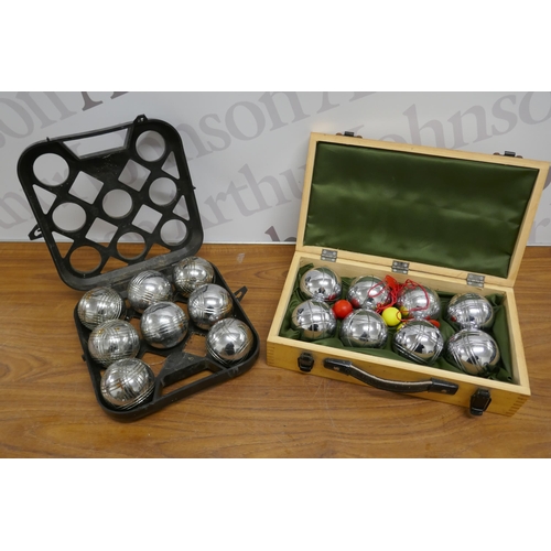 2314 - A set of Jonelle French boules in a wooden case and one other French boules garden game set