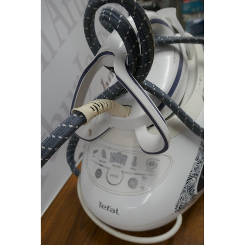 2318 - A Tefal Pro Express Ultimate steam generator iron