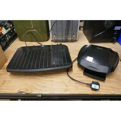 2323 - A George Foreman model 25820 grill and an Ambiano family grill