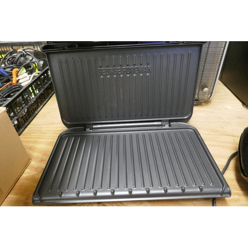 2323 - A George Foreman model 25820 grill and an Ambiano family grill