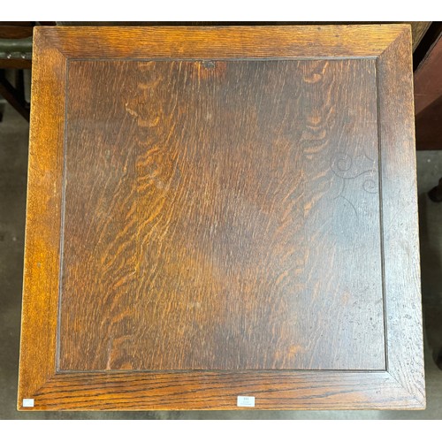151 - An early 20th Century carved oak draw-leaf table