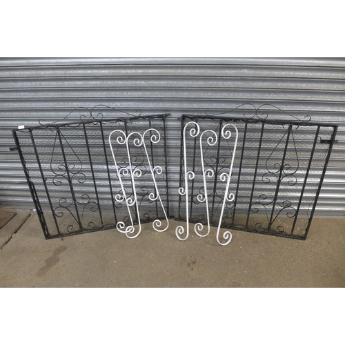 2167 - A pair of 3.5ft x 3ft metal driveway gates and 6 decorative cast metal spindles