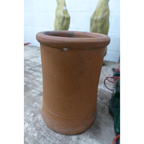 2181 - A pair of sandstone effect concrete greyhound figures and a terracotta chimney pot