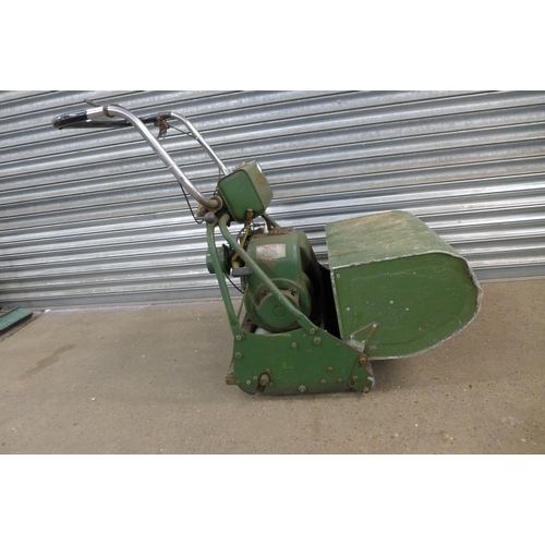 2212 - A vintage Atco petrol driven rotary lawn mower with 2 plastic 5 ltr fuel cans